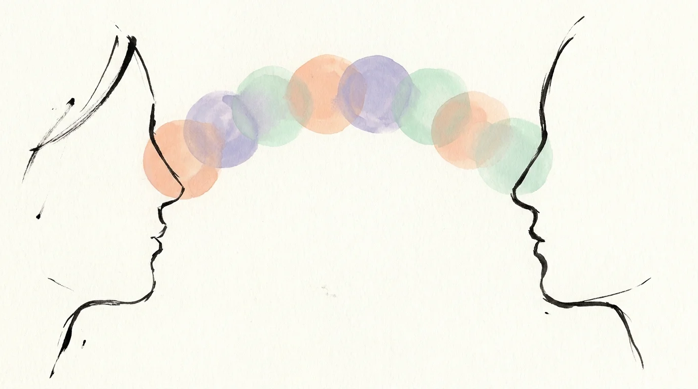 An ink and gouache illustration of two faces connected by overlapping colorful circles, representing communication.